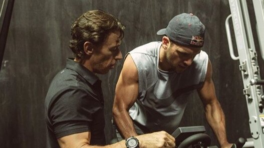 Travis Boak working out with breathing and emotional coach Nam Baldwin. Picture: Supplied.