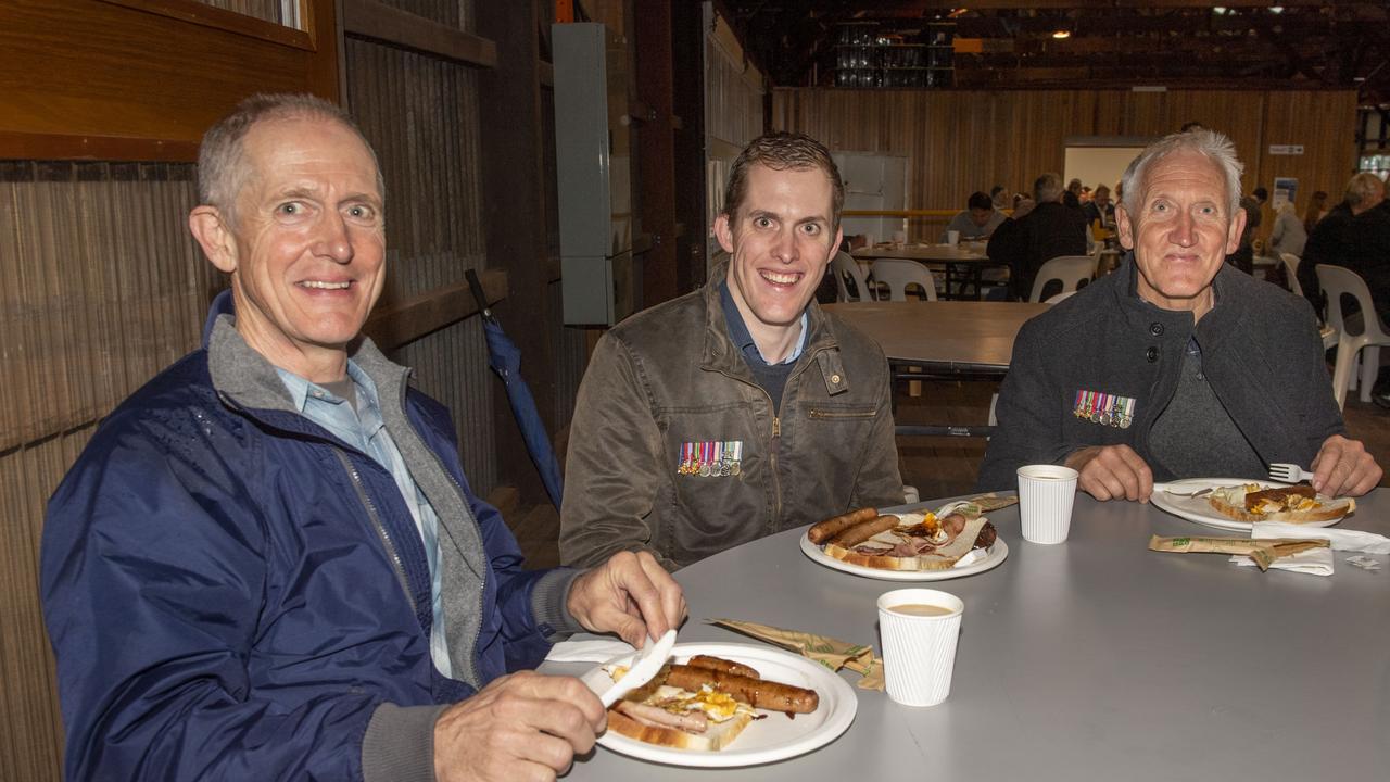 (from left) Peter, Joel and Tony Dobson enjoy the Gunfire breakfast at The Goods Shed on ANZAC DAY. Tuesday, April 25, 2023. Picture: Nev Madsen.