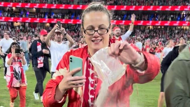 Krystal Clayton spreads her nan's ashes at the SCG after Buddy Franklin's 1000th goal. Supplied