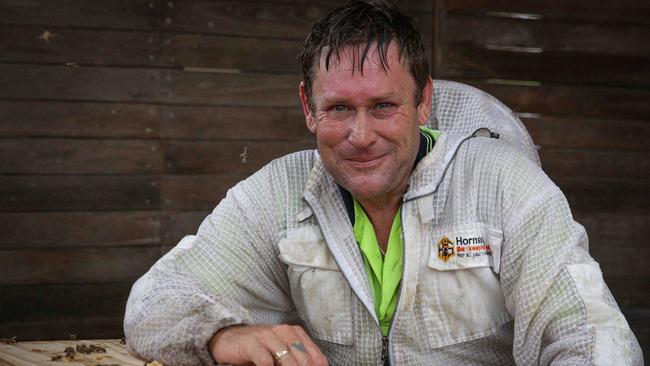 Carl ‘The Bee Man’ Skinner says a simple bowl of water in the backyard can help bees survive the hot temperatures in summer. Picture: AAP Image/Carmelo Roche.