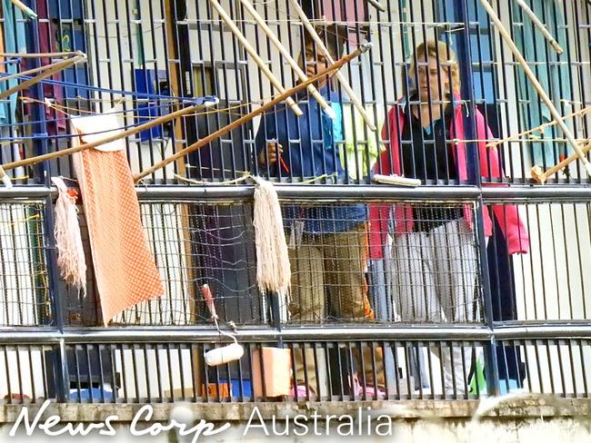 Sainsbury is seen with a fellow inmate inside the walls of the Bogota prison. Picture: Nathan Edwards