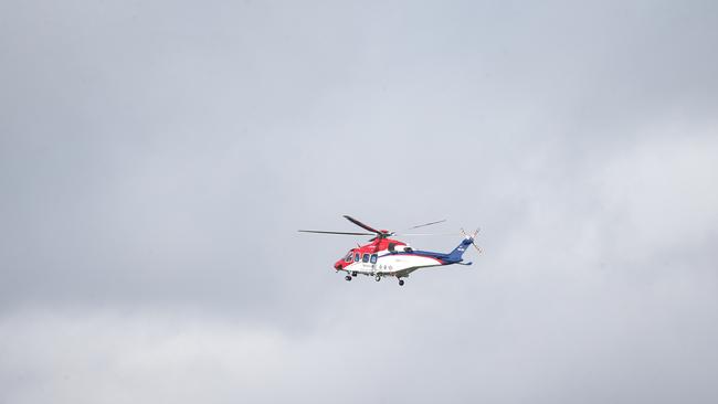 The Rescue 510 rescue helicopter assisting police on the Captain Cook Highway. Picture: Stewart McLean