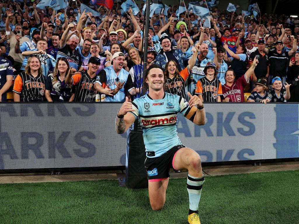 Nicho Hynes celebrates with the travelling Sharks fans. Picture: Hannah Peters/Getty Images