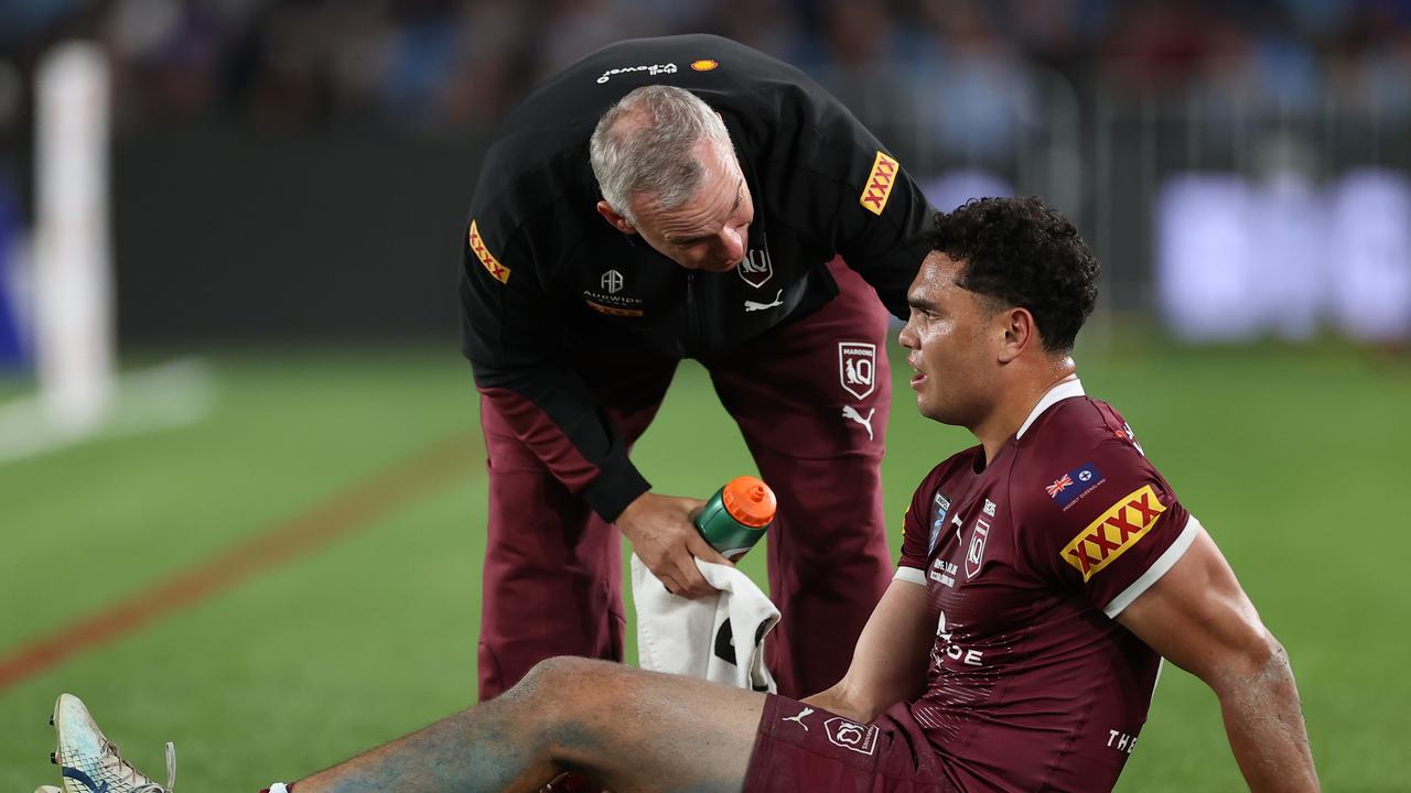 SYDNEY, AUSTRALIA - JUNE 08: Xavier Coates of the Maroons receives attention after sustaining an injury during game one of the 2022 State of Origin series between the New South Wales Blues and the Queensland Maroons at Accor Stadium on June 08, 2022 in Sydney, Australia. (Photo by Cameron Spencer/Getty Images)