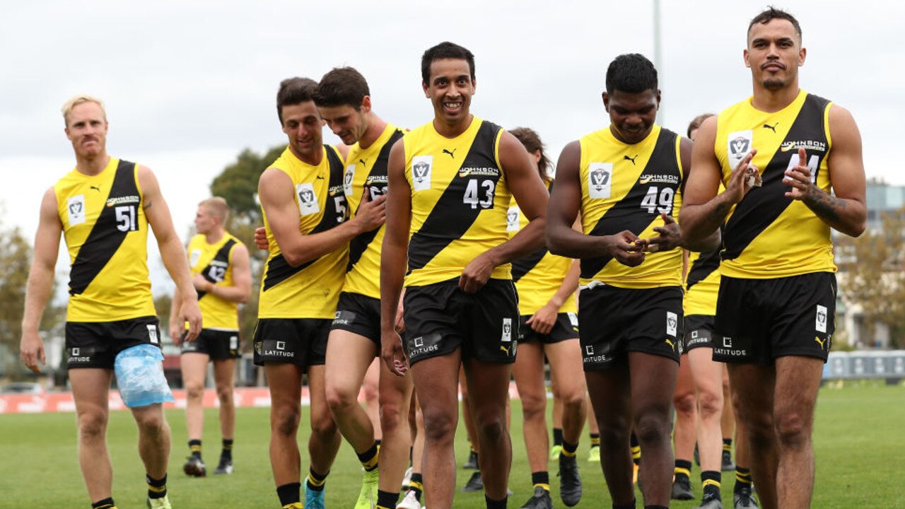 MELBOURNE, AUSTRALIA - APRIL 16: The Richmond Tigers leave the field after victory in the round one VFL match between the Richmond Tigers and Sandringham Zebras at Punt Road Oval on April 16, 2021 in Melbourne, Australia. (Photo by Graham Denholm/Getty Images)