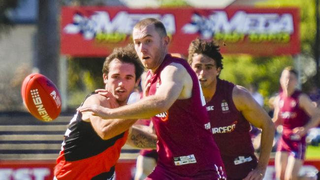 PAOC’s Cam Pritchard battles with Tea Tree Gully’s Brodie Latham.Picture: Roy VanDerVegt