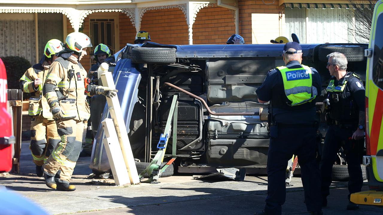 Driver rescued after car crash lands in front yard