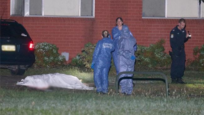 A white sheet covers the body of the man shot dead in a Kingswood driveway. Picture: Bill Hearne