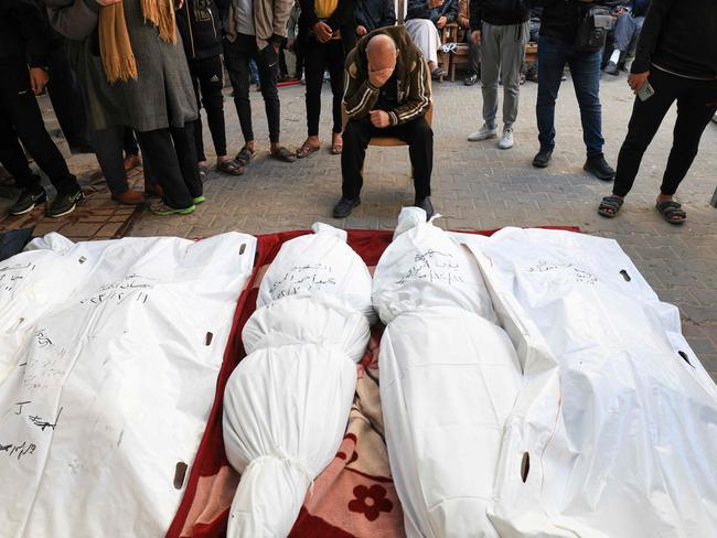 Relatives mourn over the bodies of family members at al-Najjar hospital in Rafah on the southern Gaza Strip. Picture: Mahmud Hams/AFP