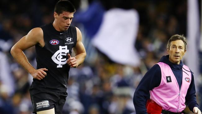 Matthew Kreuzer heads to the bench after Dangerfield’s tackle. Picture: Michael Klein