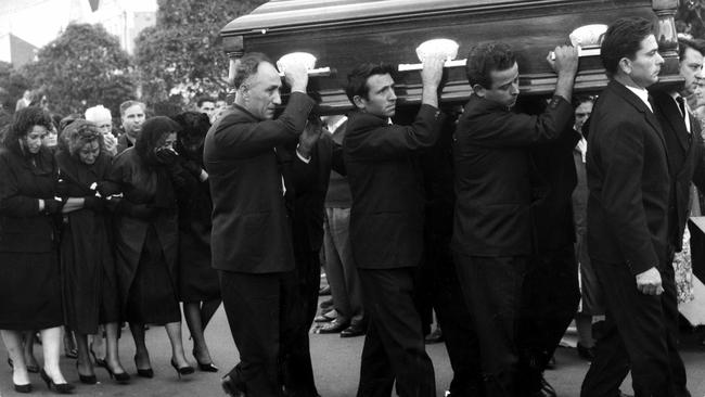 22/01/1964. Michele Scriva helps to carry the coffin at the funeral of Vincent Muratore. Muratore was a victim of the Victoria Market murders. Neg: 394 Picture: Photo File