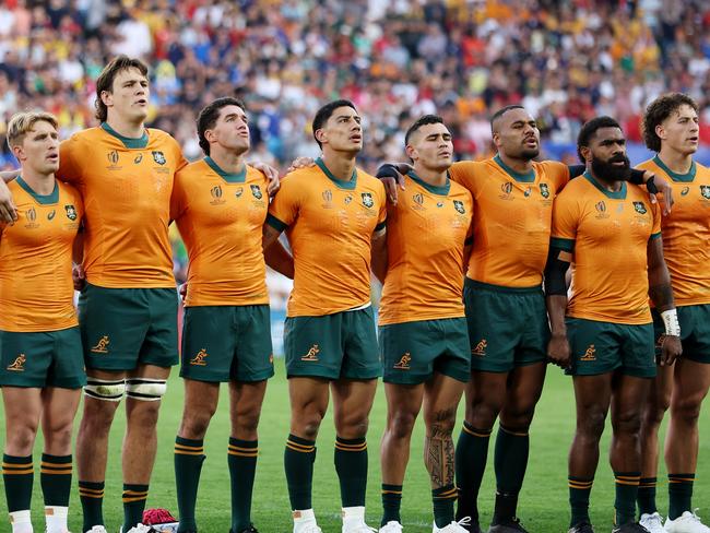 SAINT-ETIENNE, FRANCE - OCTOBER 01: The players of Australia line up during the National Anthems prior to the Rugby World Cup France 2023 match between Australia and Portugal at Stade Geoffroy-Guichard on October 01, 2023 in Saint-Etienne, France. (Photo by Chris Hyde/Getty Images)