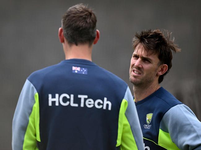 Australian cricketer Mitch Marsh (R) talks to teammate Beau Webster (L) in the nets at the Melbourne Cricket Ground (MCG) in Melbourne on December 23, 2024, ahead of the fourth cricket Test match between Australia and India starting December 26. (Photo by William WEST / AFP) / --IMAGE RESTRICTED TO EDITORIAL USE - STRICTLY NO COMMERCIAL USE--