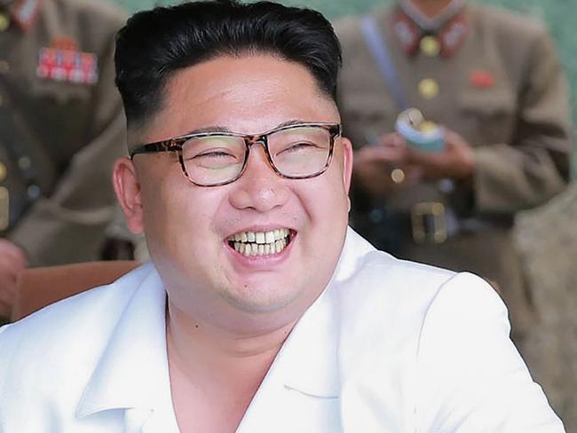 This undated photo released by North Korea's official Korean Central News Agency (KCNA) on July 21, 2016 shows North Korean leader Kim Jong-Un (C) smiling as he visits a drill for ballistic missile launch by the Hwasong artillery units of the Strategic Force of the Korean People's Army. North Korea said on July 20 its latest ballistic missile tests trialled detonation devices for possible nuclear strikes on US targets in South Korea and were personally monitored by supreme leader Kim Jong-Un. / AFP PHOTO / KCNA VIA KNS / KCNA