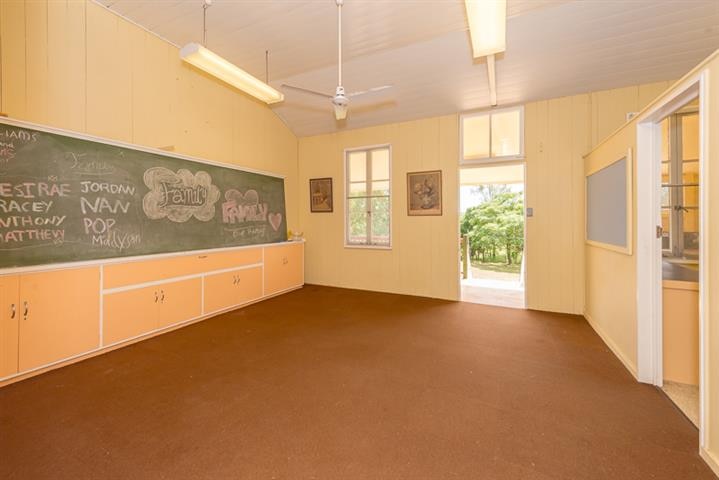 This Raglan Heritage School, built in 1879, and a three-bedroom, high set home are for sale. 