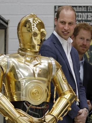 Prince William with C3P0 in West London. Picture: Adrain Dennis, Pool Via AP.