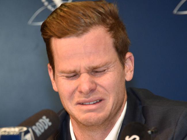 Cricketer Steve Smith reacts at a press conference at the airport in Sydney. Picture: AAP