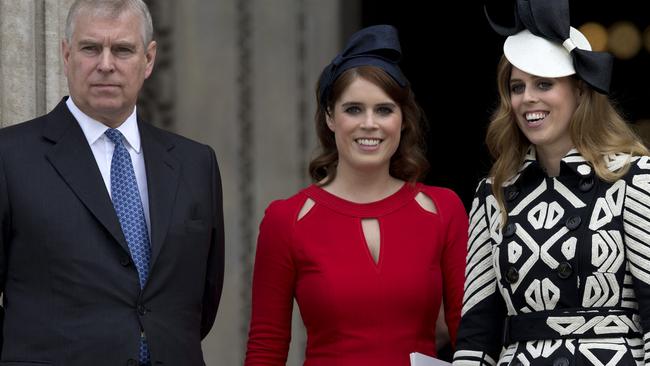 Prince Andrew with his daughters Eugenie and Beatrice. Picture: Justin Tallis/AFP