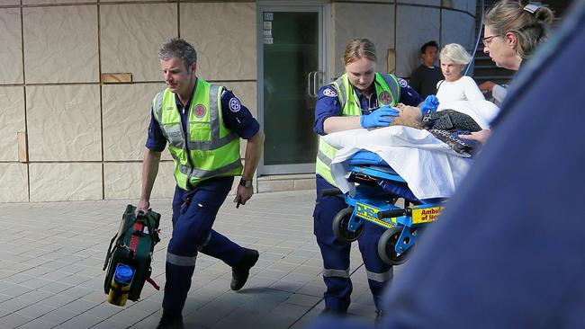 Police and ambulance crews at the scene, where Mr Sourian and three bystanders were shot last year. Photo: Adam Ward