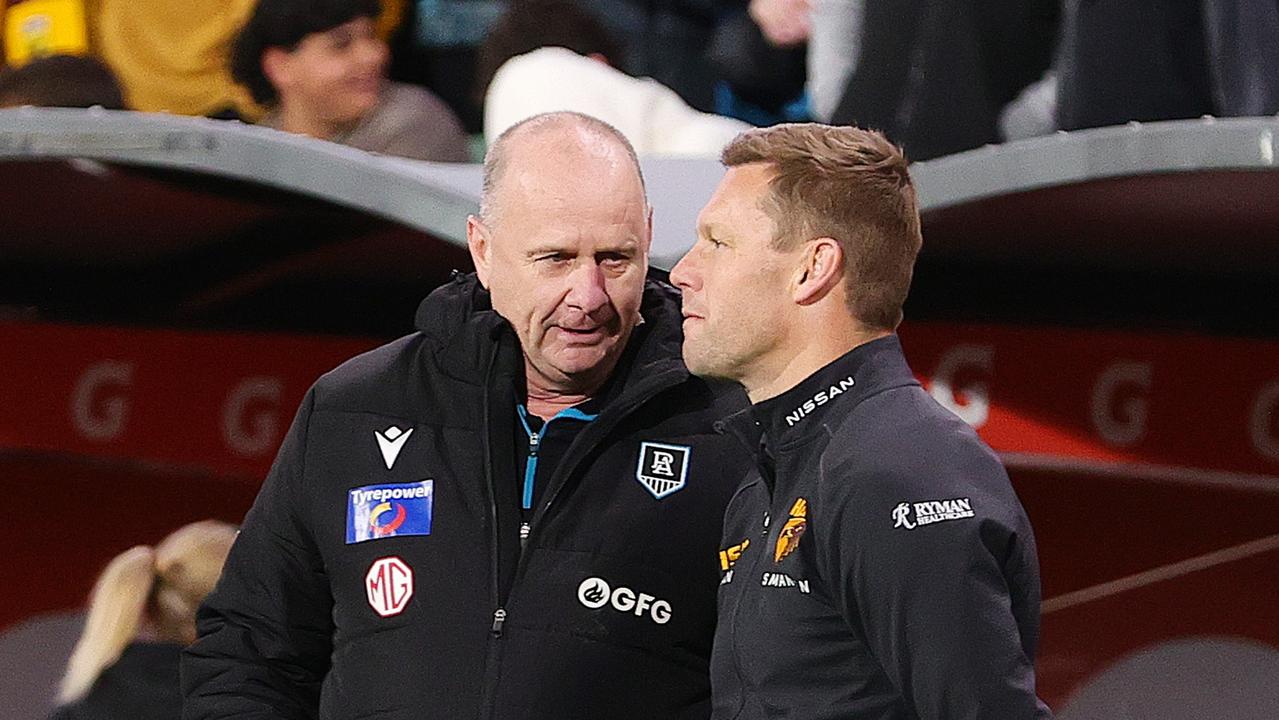 Hinkley and Mitchell before the Power coach went after Ginnivan. (Photo by Sarah Reed/AFL Photos via Getty Images)