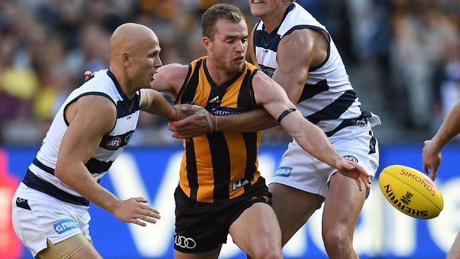 Gary Ablett and Rhys Stanley attempt to stop Tom Mitchell.