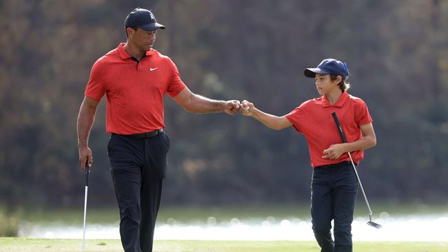 Tiger Woods and Charlie Woods celebrate a birdie during the PNC Championship in Orlando last December. Photo: Getty Images