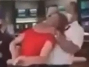 A security guard throws an unconscious man  to the floor while evicting him from a Croyden Hotel