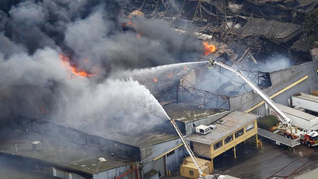 Toxic black smoke at the out-of-control fire in West Footscray. Picture: David Caird