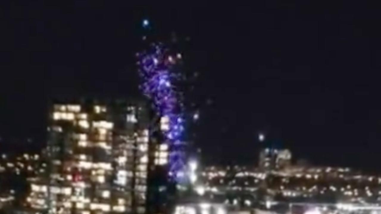 In videos posted to social media, drones were seen falling out of formation and into the Yarra River in Docklands on Friday night. Pictures: Channel 9
