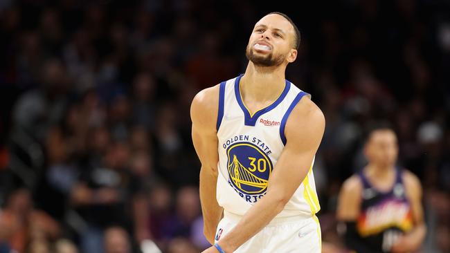 PHOENIX, ARIZONA - NOVEMBER 30: Stephen Curry #30 of the Golden State Warriors reacts after a missed shot against the Phoenix Suns during the second half of the NBA game at Footprint Center on November 30, 2021 in Phoenix, Arizona. The Suns defeated the Warriors 104-96. NOTE TO USER: User expressly acknowledges and agrees that, by downloading and or using this photograph, User is consenting to the terms and conditions of the Getty Images License Agreement. Christian Petersen/Getty Images/AFP == FOR NEWSPAPERS, INTERNET, TELCOS &amp; TELEVISION USE ONLY ==