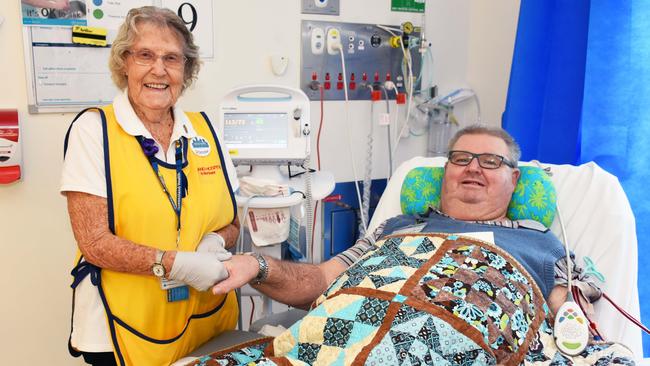 Vonnie Seabourne gives a hand massage to a Redland Hospital patient.