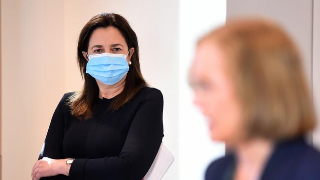 Queensland Premier Annastacia Palaszczuk watches Chief Health Officer Dr Jeannette Young during a Covid update press conference. Picture: NCA NewsWire / Dan Peled