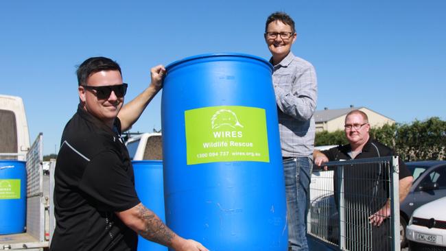 WATER FOR WILDLIFE: Landowners Ali Treanor gets a helping hand from some 200L TREE TROFFÂ® arboreal water drinkers which are being distributed free of charge for installation on their properties to help support thousands of native animals Photo: Alison Paterson