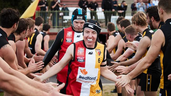 Goodwood Saints footballer Rhys Baker going through the Guard of Honour. Picture: Matt Loxton