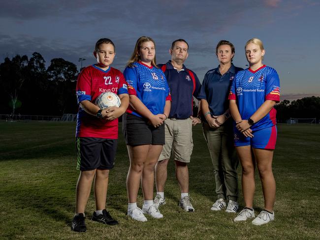 Like many, the Lyon family of Scott, Jeanette,  Brodie, 10, Sarah, 13, and Hayley 14,   are waiting to hear when community football will resume on the Gold Coast.  Picture: Jerad Williams