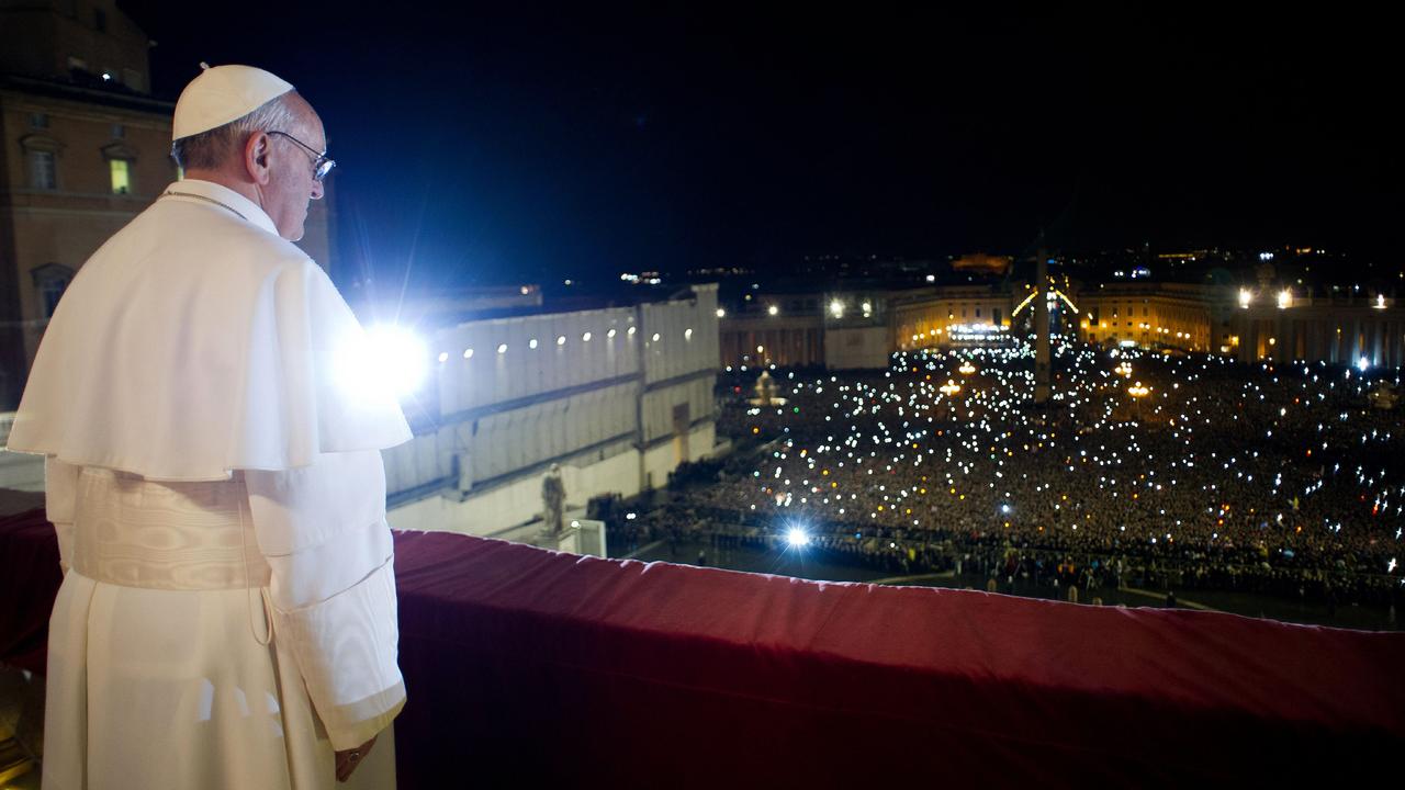 2013: Argentina's Jorge Bergoglio, elected Pope Francis I, appears at the window of St Peter's Basilica's balcony after being elected the 266th pope of the Roman Catholic Church. AFP PHOTO/OSSERVATORE ROMANO"