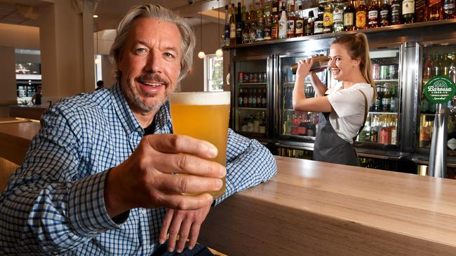 Patron caps will be removed on Tuesday at licensed venues such as the Lion Hotel in North Adelaide. Pictured are joint owner Brett Matthews and bar staff Sarah Davies. Picture: Tricia Watkinson