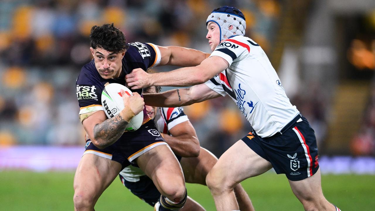 Broncos star Kotoni Staggs is tackled by Roosters' Luke Keary. Picture: NRL Photos