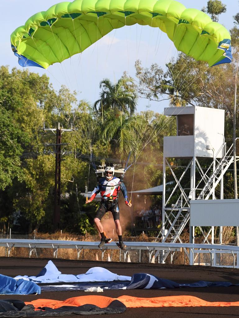 Skydivers deliver the Territory flag and Darwin Cup flag at the Darwin Cup 2022. Picture: (A)manda Parkinson