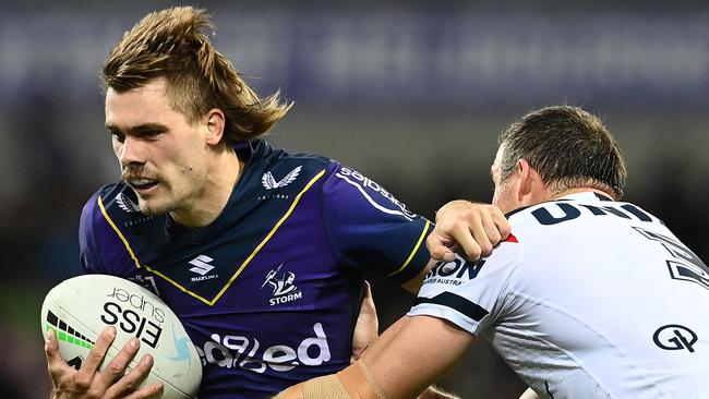 MELBOURNE, AUSTRALIA - APRIL 16:  Ryan Papenhuyzen of the Storm is tackled by Josh Morris of the Roosters during the round six NRL match between the Melbourne Storm and the Sydney Roosters at AAMI Park on April 16, 2021, in Melbourne, Australia. (Photo by Quinn Rooney/Getty Images)