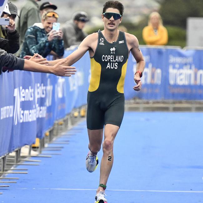 DEVONPORT, AUSTRALIA - MARCH 15: Brandon Copeland of Australia competes in the Men's Under 23 and Elite event at the 2025 Devonport Triathlon on March 15, 2025 in Devonport, Australia. (Photo by Simon Sturzaker/Getty Images)