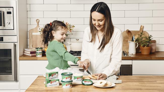 Fia (left) and Paige enjoy Bega's new cream cheese: Bega’s new block and spreadable cream cheese will hit supermarket shelves next week. Picture: Supplied