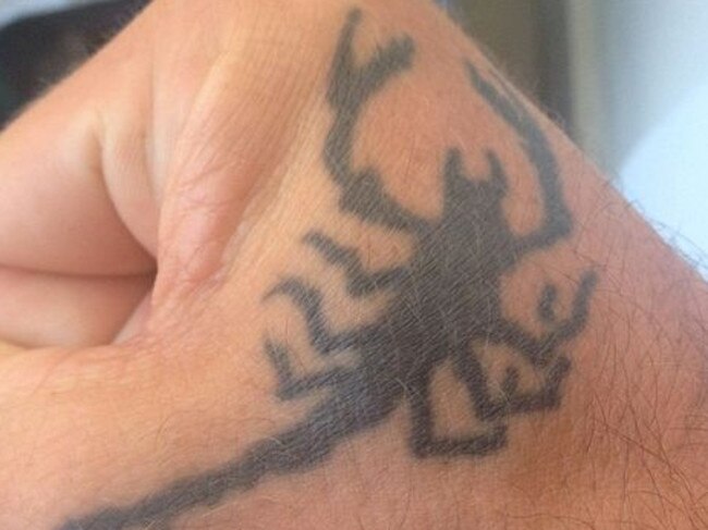 A scorpion tattoo on Jed Allen’s hand