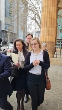 Elizabeth Meg Krainz exits court