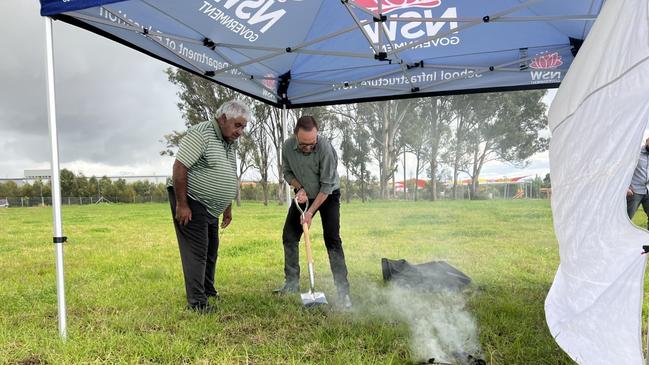 Uncle Ivan at the grounds of the new school performing a smoking ceremony at the sod turning.