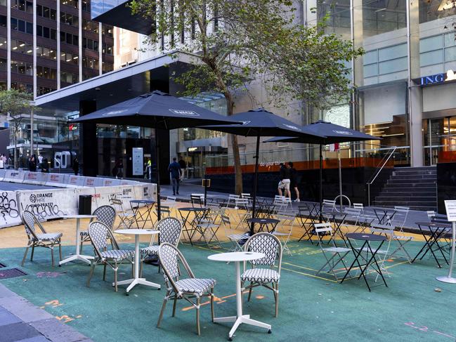 12:4PM on a Friday: Al fresco dining on Margaret St in the CBD, surrounded by office blocks, all but abandoned. Picture: Tom Parrish