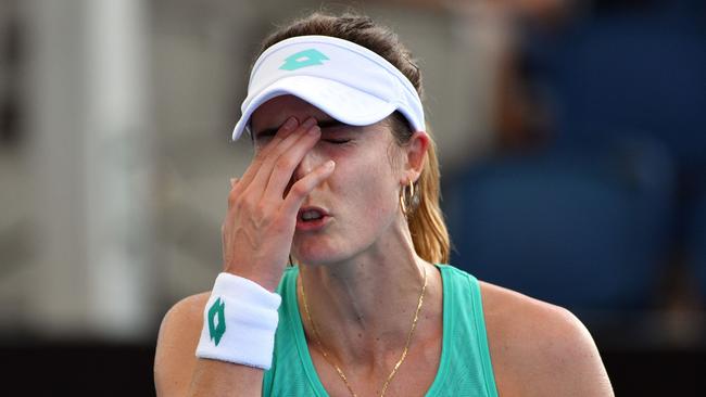 (FILES) This file photo taken on January 02, 2018 shows Alize Cornet of France reacting on a point against Mirjana Lucic-Baroni of Croatia during their second round match at the Brisbane International tennis tournament at the Pat Rafter Arena in Brisbane. Frenchwoman Alize Cornet was placed under a disciplinary investigation on January 24, 2018, after missing three random drug tests, the French tennis federation announced (FFT) on January 24, 2018.  / AFP PHOTO / Saeed KHAN / -- IMAGE RESTRICTED TO EDITORIAL USE - STRICTLY NO COMMERCIAL USE --