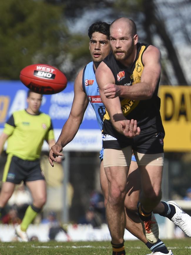 Glenelg's Aaron Joseph in front of Sturt's Josh Dodd. Picture: Naomi Jellicoe