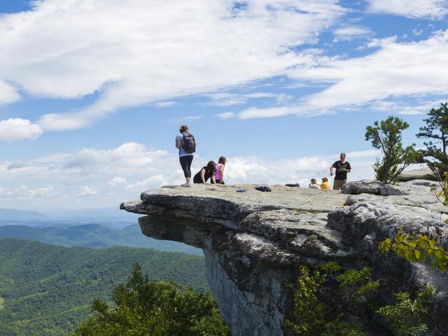 Hikers on McAfee Knob, a lookout on the Appalachian Trail.