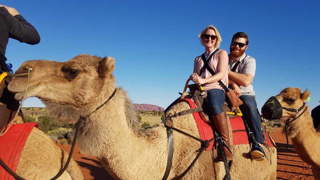 Cynthia and Dustyn Harvey enjoy a camel ride during their Mystery Break to Central Australia. Picture: Contributed